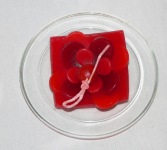 Red Lotus Candle on a Glass Plate